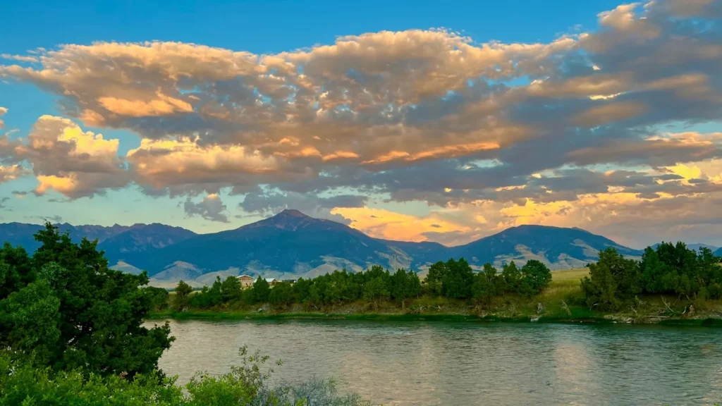 A river running below a distant mountain range in the Rockies